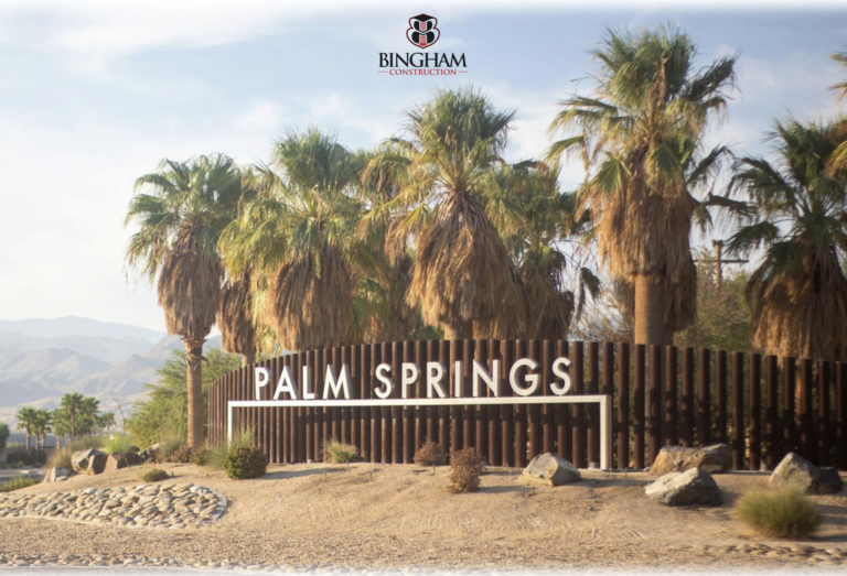 A sign that says palm springs and the name of the resort.