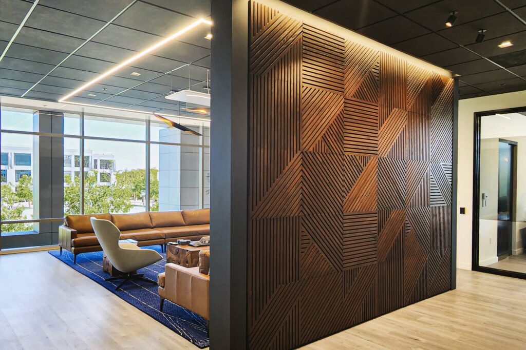 A room with wood paneling and a couch.