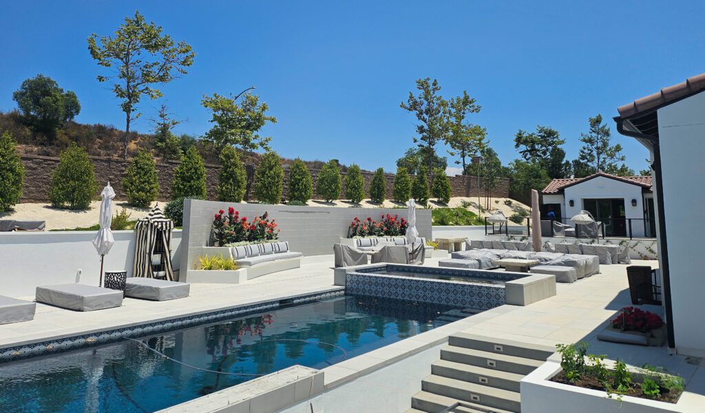 Luxury backyard pool and patio area.