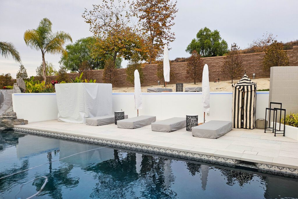 Poolside lounge chairs and umbrellas.