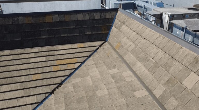 Rooftop view: gray and tan shingles.