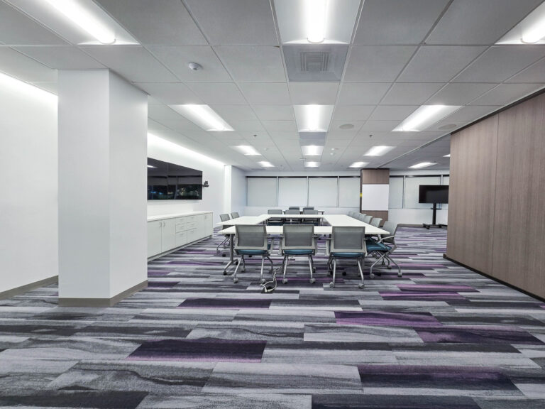 Modern conference room with large table setup.