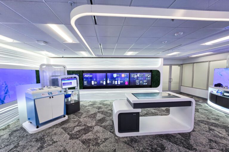 Modern tech showroom with interactive displays.