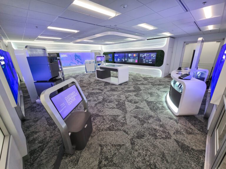 Modern technology showroom with interactive displays.