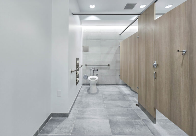 Modern public restroom with accessible stall.
