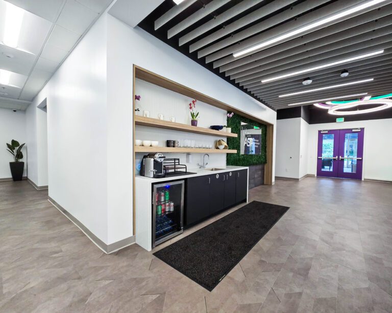 Modern office lobby with refreshment area.