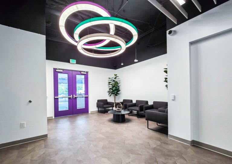 Modern office lobby with colorful circular lights.