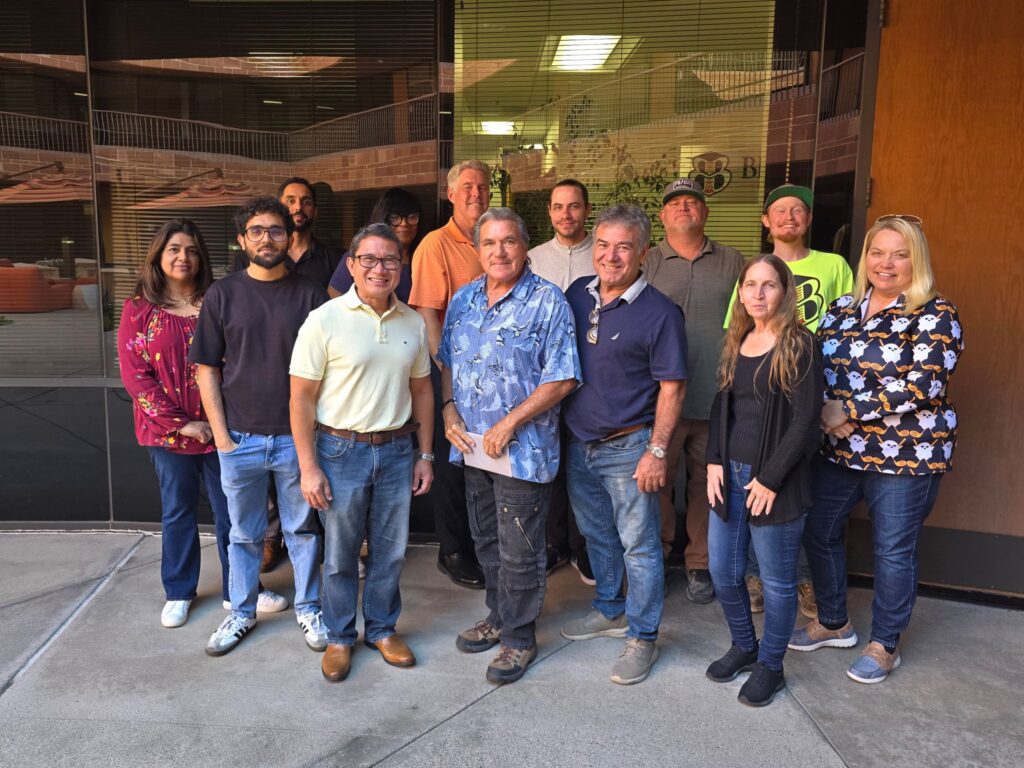 Group of people standing outside a building.